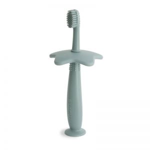 Brosse à dents d'apprentissage en silicone vert - Mushie  Produits