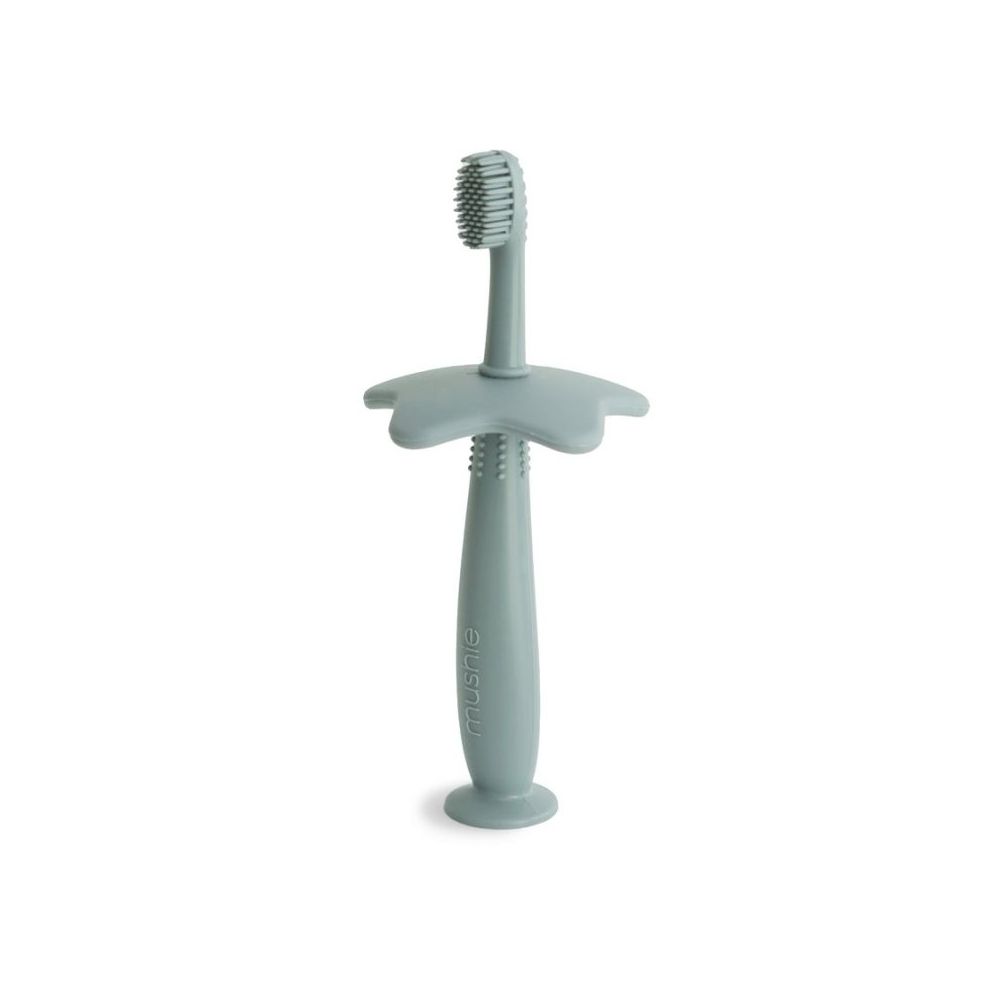 Brosse à dents d'apprentissage en silicone vert - Mushie  Produits